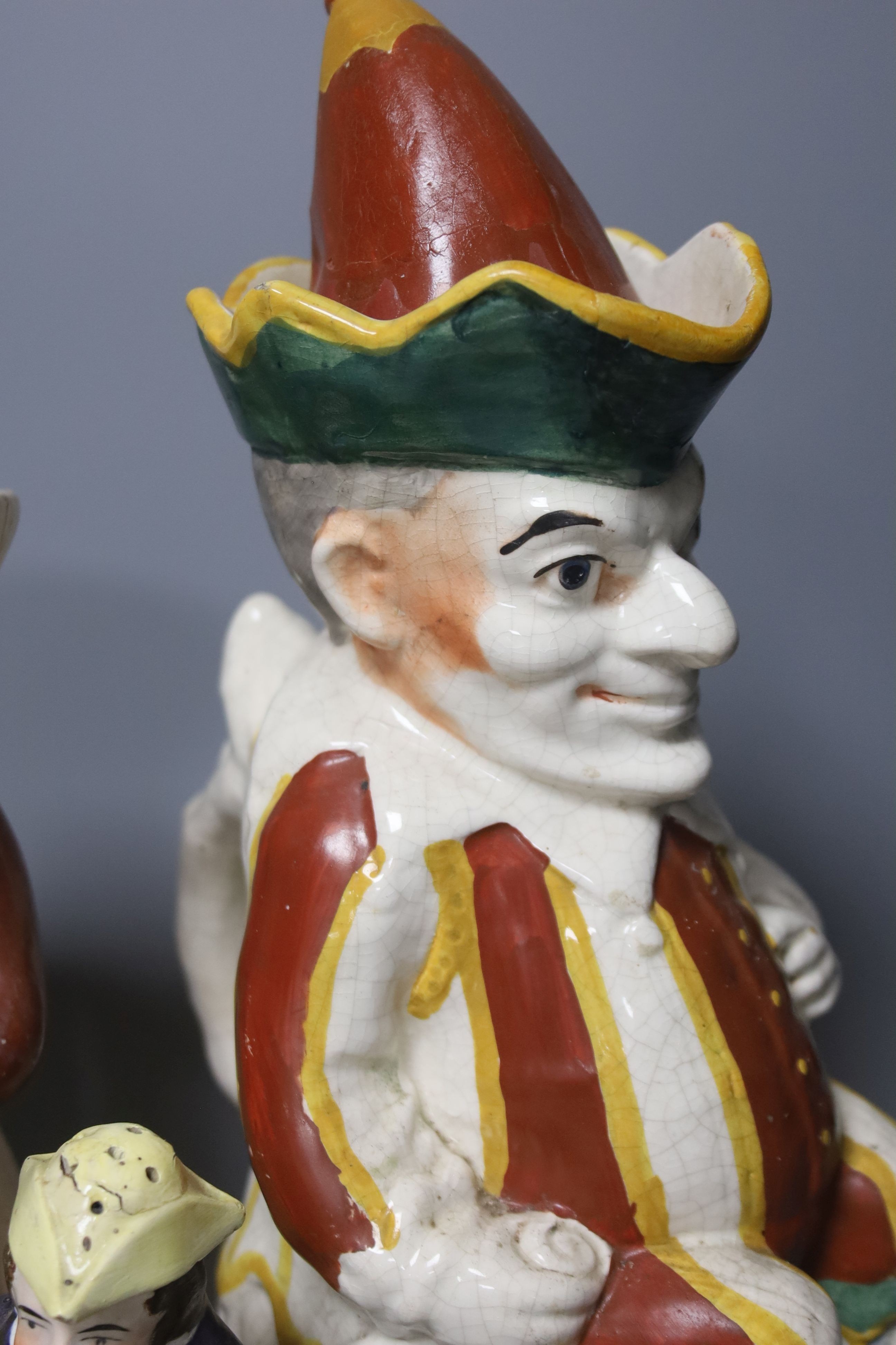A group of assorted 19th century and later Staffordshire ceramics including a Toby jug, Colston Boy and Red Maid Girl Bristol